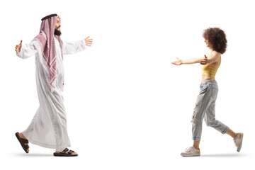 Canvas Print - Full length profile shot of a saudi arab man meeting and greeting a casual young female