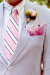 Groom in pink and blue seersucker suit