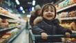 Happy child with family shopping in a grocery store shopping for food.