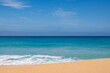 © Austockphoto - Landscape view of sand and ocean, and blue sky