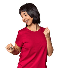 Sticker - Young Hispanic woman with short black hair in studio dancing and having fun.