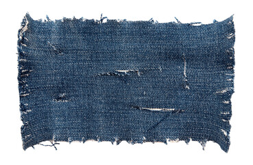 Wall Mural - Piece of torn denim on a white background. Denim texture