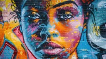 A Vibrant Graffiti Mural Adorns The Brick Wall Behind The Subject, Adding An Urban Edge To The Portrait.