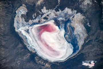 Wall Mural - land feature with pink colors in argentina. digital enhancement of an image by nasa