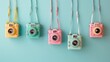 Colorful Vintage Cameras Hanging on Pastel Background - Photography Concept