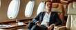 Bussiness man sits in the luxurious setting of a private jet's cabin