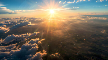 Wall Mural - A breathtaking aerial view captured from a plane flying high above the earth, with majestic clouds swirling below and the sun casting golden rays across the horizon