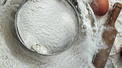 Sticker - Super slow motion of the flour sieve falls with splashes of flour. High quality FullHD footage