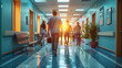 people in a hospital corridor in the rays of light