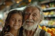 Grandpa and granddaughter shop in the supermarket. Elderly man and girl in front of the vegetable shops of the store.
