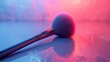 Close-up of a makeup brush on colorful background