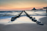 Fototapeta  - pier of Heringsdorf on German isle of Usedom in sunrise light