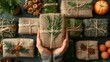 Female hands pack a burlap gift. Eco-friendly products are laid out on a table.