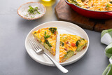 Fototapeta Mapy - Healthy frittata or quiche with broccoli and red pepper, two slices on plate
