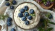 Blueberry and yogurt bowl on table, top view