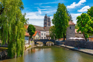 Bistrica river and the Saint Stephen parish church in Slovenian town Ribnica