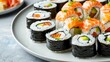 Delectable sushi platter with salmon, avocado, rice, nori, roll, and Japanese elements