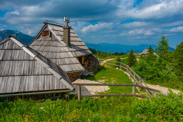 Wall Mural - Wooden huts at Velika Planina mountains in Slovenia