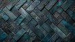 Herringbone pattern of dark slate tiles with subtle blue hues. Textured geometric background.