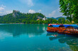 Gondolas in front of the Bled castle in Slovenia