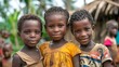 children of sierra leone, Three smiling African children standing together in a village setting. 