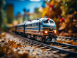 Colorful bokeh adds charm to a model train on a railway track layout, depicting leisure hobbies