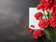 A top-down view showcases Mother's Day greetings with a carnation flower on a desk