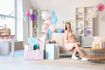 Sticker - Young pregnant woman sitting on sofa at baby shower party