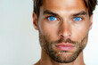 Portrait of Handsome Man with Intense Blue Eyes and Stubble