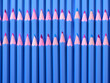 Pink background serves as a banner for sharpened blue pencils, ideal for sketching