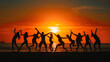 © ART-PHOTOS - This image captures a group of people silhouetted against a vibrant sunset at the beach. They are in various poses of dance and celebration, with their arms raised, seemingly in mid-motion, which conv