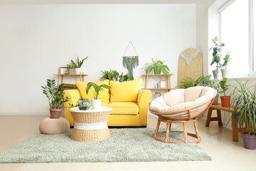 Sticker - Interior of living room with plants, sofa and armchair