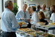 Business people celebrating company milestone anniversary with catered lunch