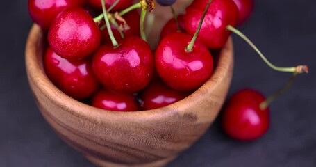 Wall Mural - ripe red cherries on the table, the use of sweet cherry berries in cooking