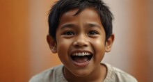 Young Indonesian Child Boy On Plain Bright Orange Background Laughing Hysterically Looking At Camera Background Banner Template Ad Marketing Concept From Generative AI