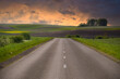 © NetPix - Asphalt road running through countryside landscape