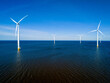 A group of wind turbines in the oceans surface in the Netherlands Flevoland