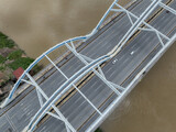 Fototapeta Miasto - Aerial view of Dong Tru bridge crossing Red River in Hanoi