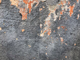 Fototapeta Tulipany - A peeling paint wall with layers of chipped and faded colors