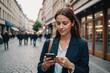 © ThomasLENNE - Woman using smart phone in the city