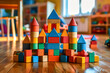 Children castle built from colorful wooden blocks on wooden floor