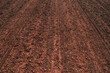 Texture of brown agricultural soil ready for tillage