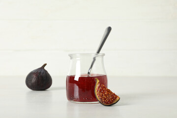 Sticker - Fig jam in jar, spoon and figs on white background