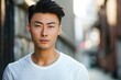 Confident Young Asian Man in Urban Setting