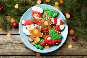 Wall Mural - Different tasty Christmas cookies and decor on wooden table, flat lay