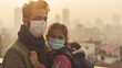 Family with protective masks against urban air pollution, depicting health concerns