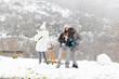 People enjoying snowy weather outdoors