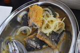 Fototapeta Miasto - Fried fish in vinegar marinade