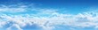 Clear blue sky with puffy white clouds scattered throughout, AI-generated.