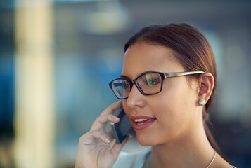 Canvas Print - Woman, talking and phone call in workplace for business with communication, glasses and graphic design. Office, agency job and mobile in hand for speaking conversation, internet and creative company